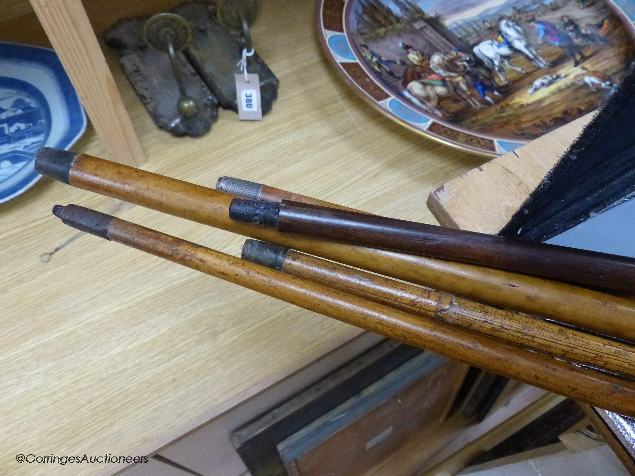 Five various walking sticks: three horn-handled, one silver-mounted and the other antler